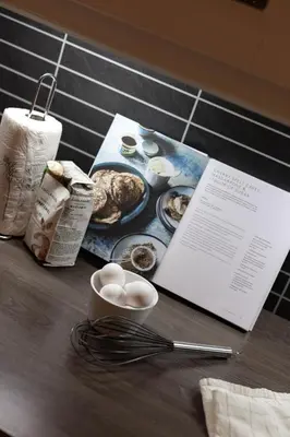 a table with a plate of food and a menu at Skoglund privat Villa in Trysil