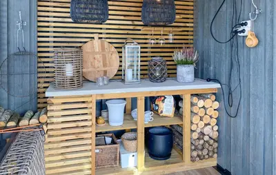 a wooden shelf with logs and other items on it at 3 Bedroom Awesome Home In Nordfjordeid in Nordfjordeid