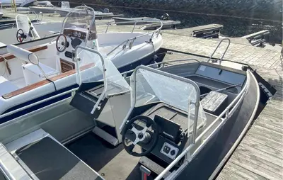 a boat is docked in a dock with its door open at 4 Bedroom Gorgeous Home In Bjugn in Moen