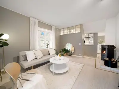 a living room with a couch and a table at Stor leilighet i Bergen sentrum! in Bergen