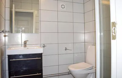 a white bathroom with a sink and a toilet at Stunning Home In Trysil With Sauna in Trysil