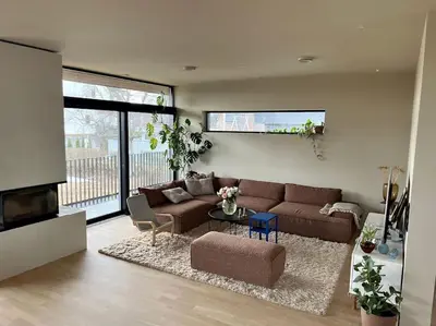 a living room with a couch and a table at Unik funkisbolig leies ut til ski-VM in Lund