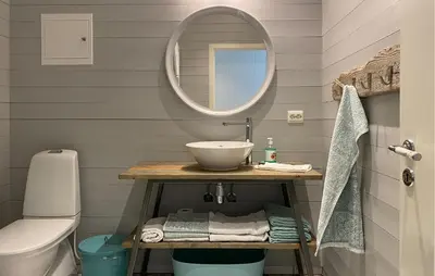 a bathroom with a sink and a mirror at 4 Bedroom Nice Home In Deknepollen in Måløy