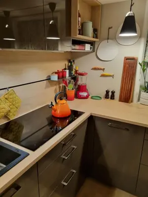 a kitchen with a stove with a tea kettle on it at Brygga B&B Trondheim sentrum, privat rom i vårt hjem in Trondheim