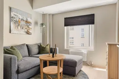 a living room with a couch and a table at Cozy studio in Bergen center in Bergen