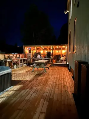 a wooden deck with a picnic table on it at Enebolig Trondheim, familievennlig, nytt 2023 in Trondheim