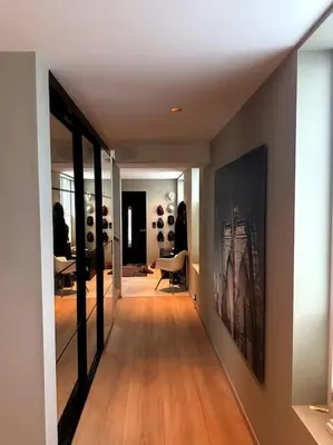 a hallway with a room with a bunch of wine bottles at Enebolig Trondheim, familievennlig, nytt 2023 in Trondheim