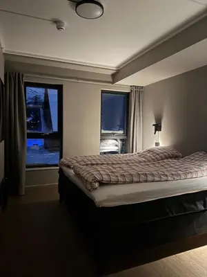 a bedroom with a large bed and a window at Chalet Chablis in Hemsedal