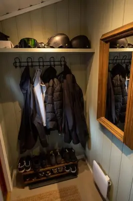 a closet with a bunch of coats and shoes at Cozy apartment close to the ski resort in Oppdal