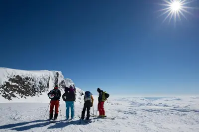 a group of people on skis on a snow covered mountain at Old Cabin Vibe, Perfect For Families Or Couples in Beitostøl