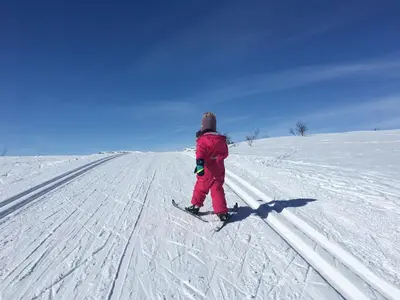a person is standing on skis in the snow at Perfectly Located Timber Cabin For 6-8 Guests in Beitostøl