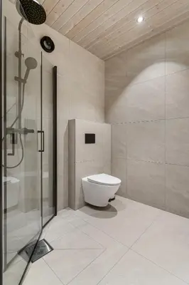a bathroom with a toilet and a shower at Tenden Panorama in Stryn