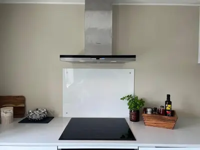 a kitchen with a white counter top with a stove at Hellegata 5 - in the heart of Ålesund in Ålesund