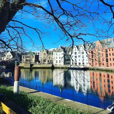 a view of a river in a city with buildings at Hellegata 5 - in the heart of Ålesund in Ålesund