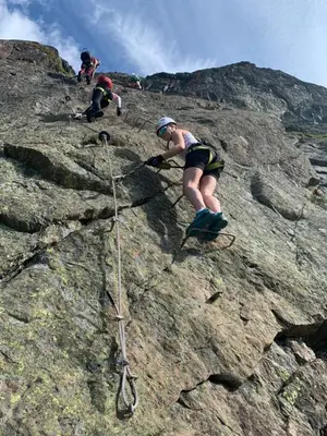 a group of people climbing on a rocky mountain at Mountain Getaway With Sauna And Views in Beitostøl