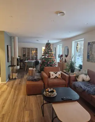 a living room with a christmas tree in it at Ski-VM i Trondheim 2025, house with 5 big bedrooms in Trondheim