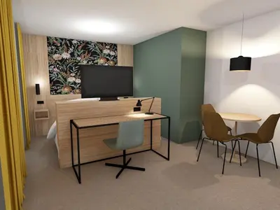 a room with a desk with a tv and two chairs at Thon Hotel Straume in Straume