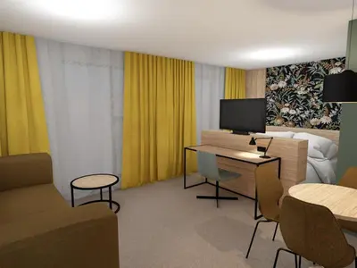 a hotel room with a desk with a tv and a bed at Thon Hotel Straume in Straume