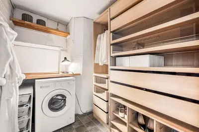 a laundry room with a washer and dryer at Bergen City Center Bryggen in Bergen