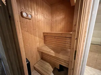 a small wooden sauna with a bench in it at Modern Retreat By Beitostølen Ski Stadium in Beitostøl