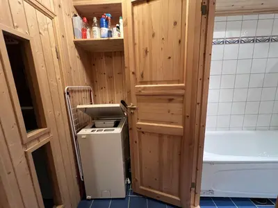 a bathroom with a small refrigerator and a toilet at 3-Story Apartment Near Slopes With Sauna And Views in Beitostøl