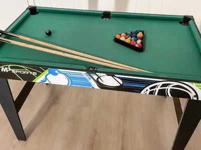 a green pool table with cue balls on it at 12 person holiday home in Davik in Davik