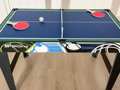 a ping pong table with ping pong balls on it at 12 person holiday home in Davik in Davik