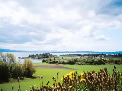a golf course with a view of the water at 8 person holiday home in frosta in Vollen