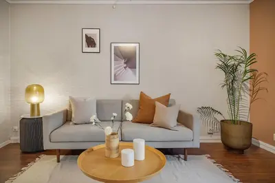 a living room with a couch and a table at Leilighet - midt i sentrum! in Bergen