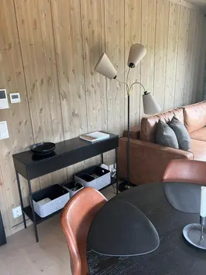 a living room with a couch and a table at Mosetertoppen Skistadion - Hafjell Ski Resort in Hafjell