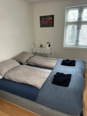 a bed in a bedroom with two pillows on it at Prime location, 400 m from the town centre in Vossevangen