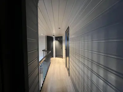 a hallway leading to a door in a house at Large Balcony With Panoramic Mountain Views in Beitostøl