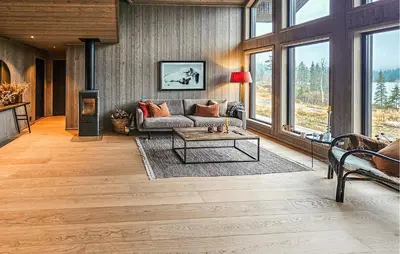 a living room with a couch and a table at Stunning Home In Vinje With Wifi in Trovatn