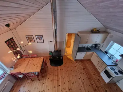 an overhead view of a kitchen with a wooden table at Koselig hytte sentralt på Norefjell, ski in & out in Surteberg