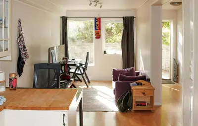 a living room with a table and chairs at Gorgeous Apartment With Wifi in Godvik