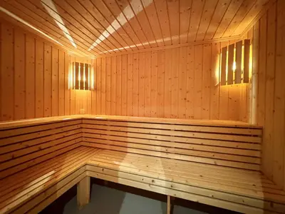 a wooden sauna with two lights on top of it at Spacious cabin with beautiful Geilo views in Geilo