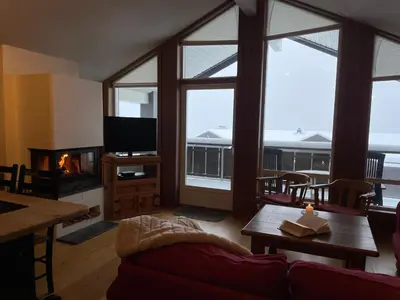 a living room with a couch and a fireplace at Bright 2-Bedroom With Terrace And Fireplace in Beitostøl