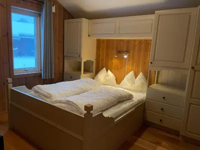 a bedroom with a bed and a window at Bright 2-Bedroom With Terrace And Fireplace in Beitostøl
