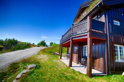 a house on the side of a road at Apartment By Cross-Country And Alpine Slopes in Beitostøl