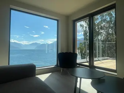 a living room with a view of the water at Amazing View in Stranda
