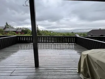 a view of a wooden deck with a table on it at Bright, Open Apartment In Beitostølen in Beitostøl