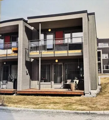 a large house with a porch and a balcony at Skyttarbakken 57 in Heimdal