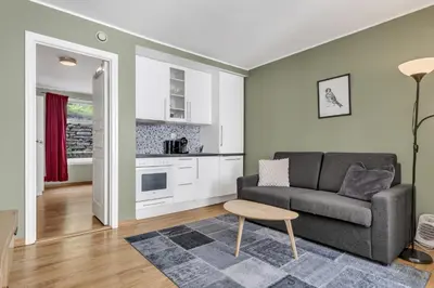a living room with a couch and a table at City Retreat in Bergen