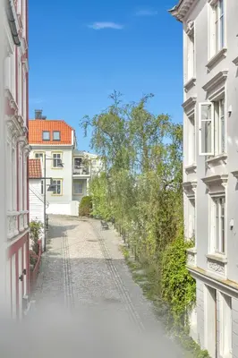 an empty street in a city with buildings at City Retreat in Bergen