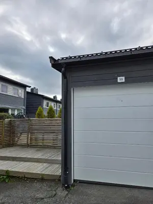 a garage door in front of a house at Exclusive three-story villa near the ski center in Trondheim