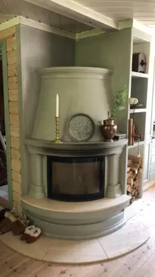 a fireplace in a living room with a candle at PARADISET - a beautiful pearl 1,45 minutes from Trondheim in Surnadal