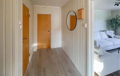 a hallway with a mirror and a living room at Beautiful Home In Vestre Gausdal in Vestre Gausdal
