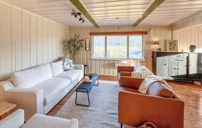 a living room with a couch and two chairs at Beautiful Home In Vestre Gausdal in Vestre Gausdal