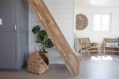 a hallway with a wooden arch in a room with a table at Paradise by the Seaside in Hitra