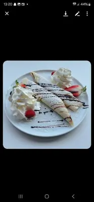 a white plate with some food on it at Eides Hotel in Høyanger